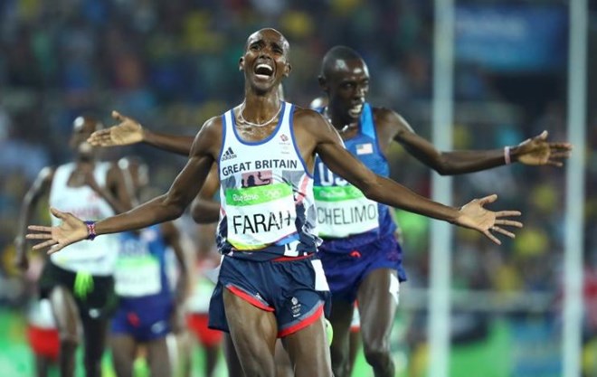 2016 Rio Olympics - Athletics - Final - Men's 5000m Final - Olympic Stadium - Rio de Janeiro, Brazil - 20/08/2016. Mo Farah (GBR) of Britain celebrates winning the gold. REUTERS/Lucy Nicholson